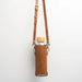 Leather water bottle holder with strap and glass bottle