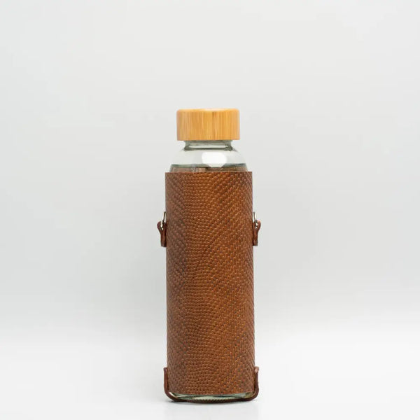 Leather water bottle holder with strap and glass bottle