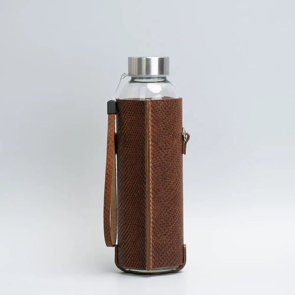 Leather water bottle holder with strap and glass bottle