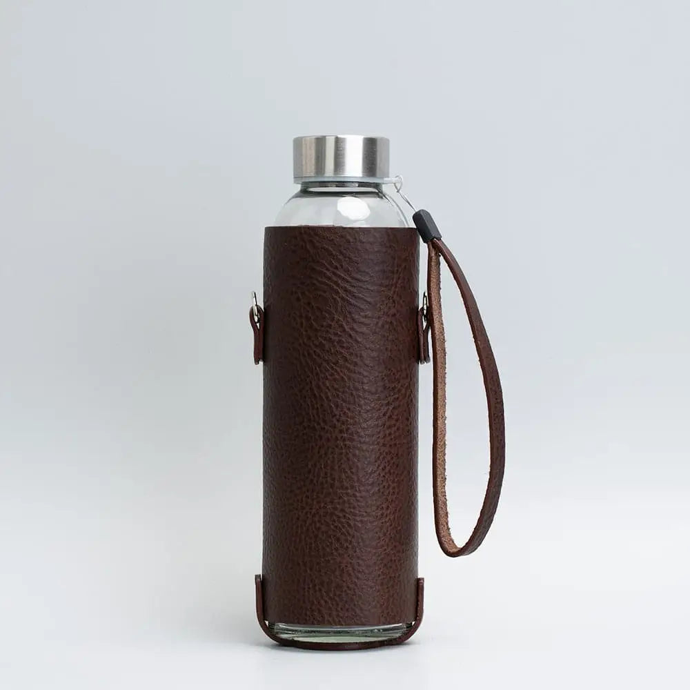 Leather water bottle holder with strap and glass bottle