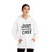 Stay cozy in style with our “just cast” print hooded